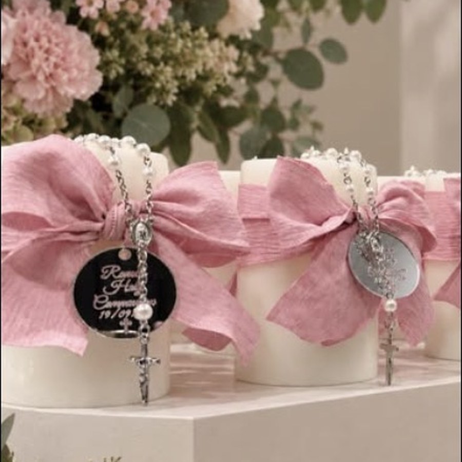 Christening candles with rosary charms