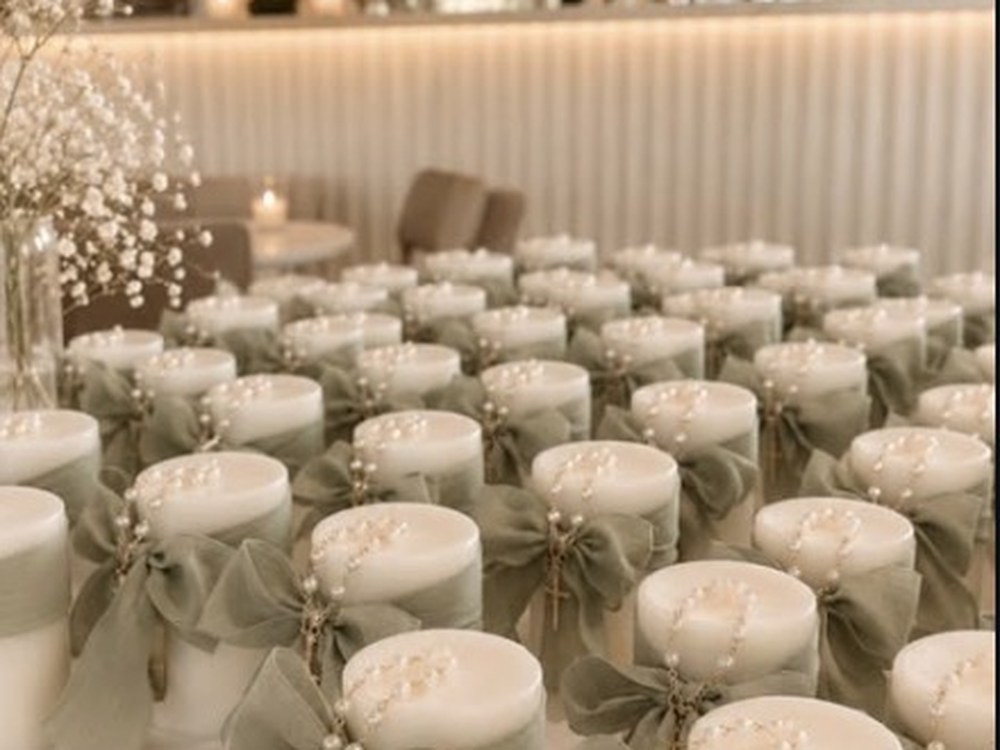 Candle favours set across a banquet table